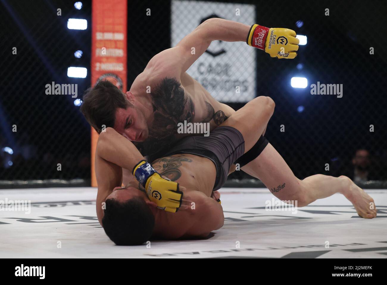 MANCHESTER, UK. APR 2ND Dylan Hazan punches Raymison Bruno during the Cage Warriors 136 event at the BEC Arena, Manchester on Saturday 2nd April 2022. (Credit: Pat Scaasi | MI News) Credit: MI News & Sport /Alamy Live News Stock Photo