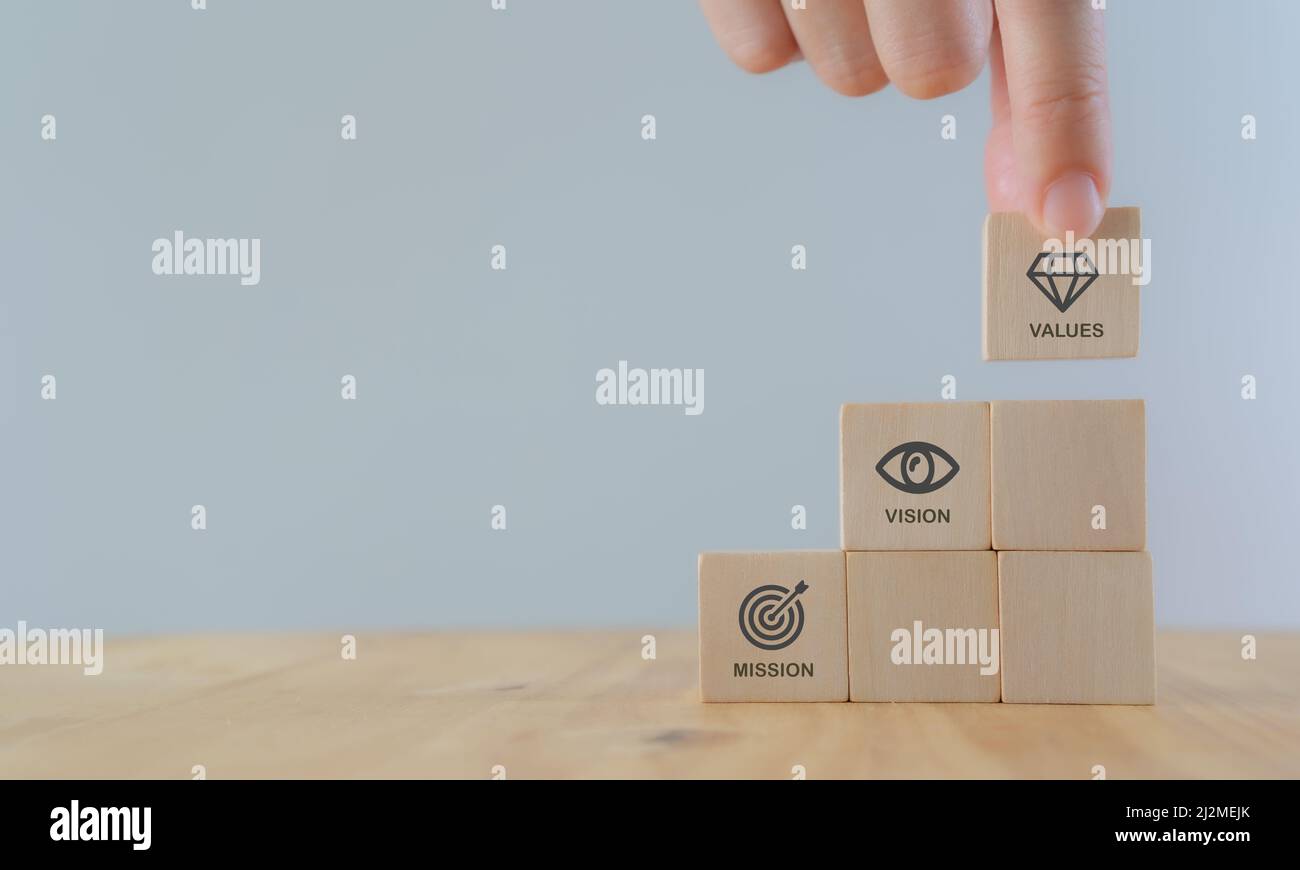 Mission vision values concept icon on wooden cubes stairs on beautiful ...