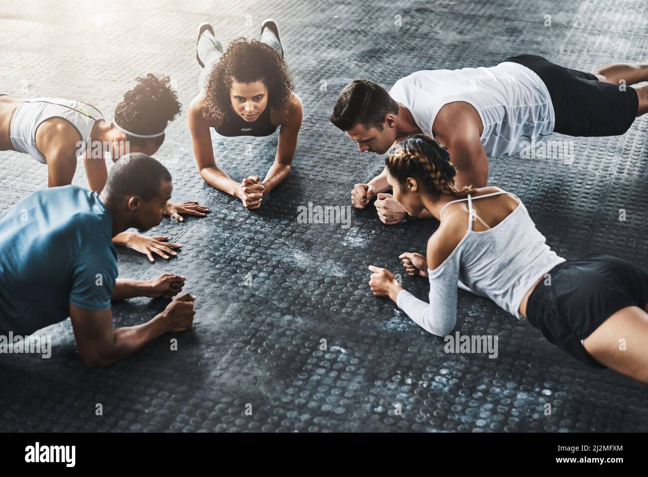 Planking so simple, so effective. Shot of a group of young people