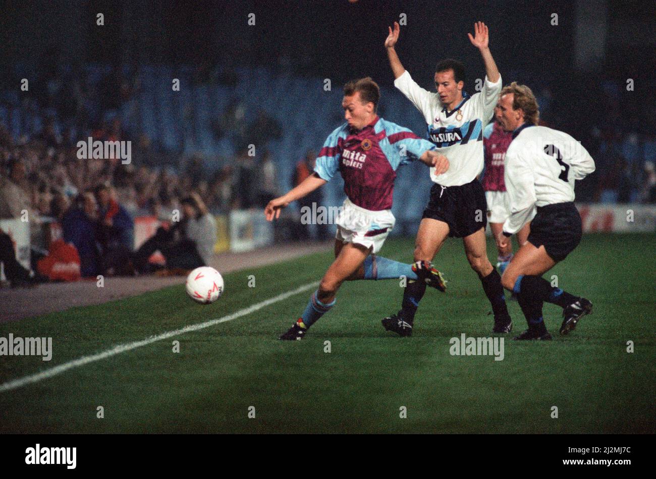 UEFA Cup 2nd round 1st leg match, Aston Villa 2 - 0 Inter Milan held at Villa Park. David Platt on the ball watched by Inter defenders including Andreas Brehme (right). 24th October 1990. Stock Photo