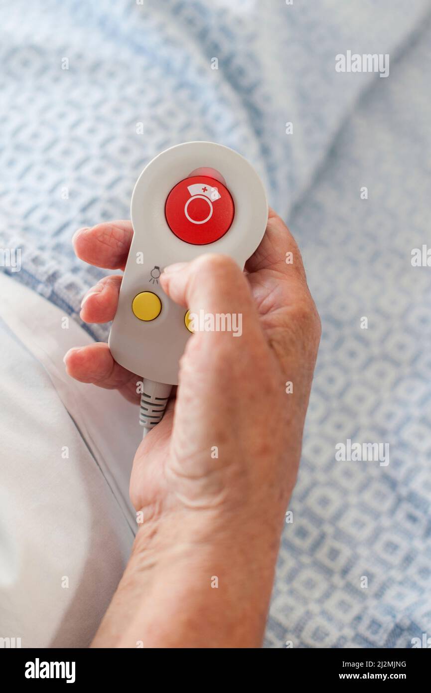 Patient holding alarm button Stock Photo Alamy