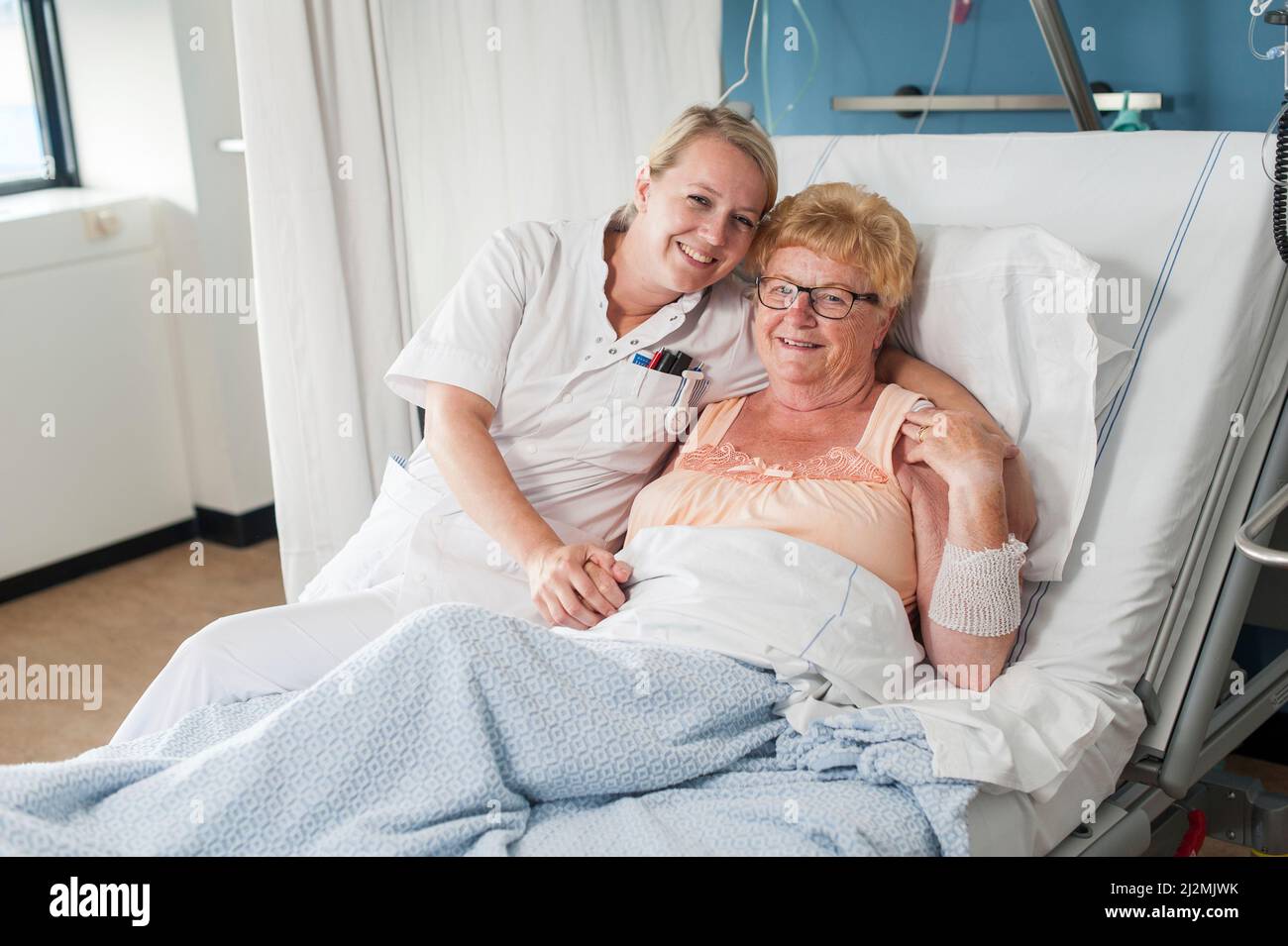 Smiling nurse and patient Stock Photo