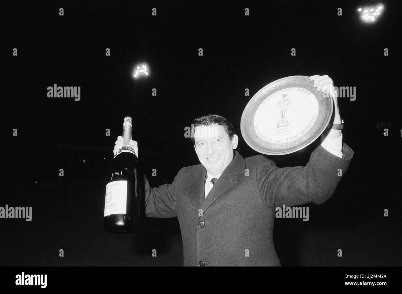 Graham Taylor, Aston Villa manager is presented with a jeroboam of champagne and award for his second consecutive Barclays Bank Manager of the Month award, Villa Park,Wednesday 10th January 1990. Stock Photo