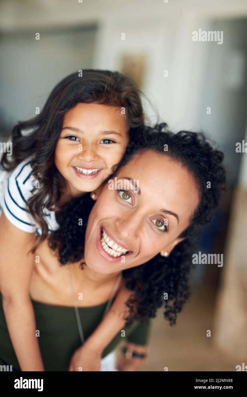 Every minute together is so enjoyable and precious. Portrait of a mother and daughter bonding together at home. Stock Photo
