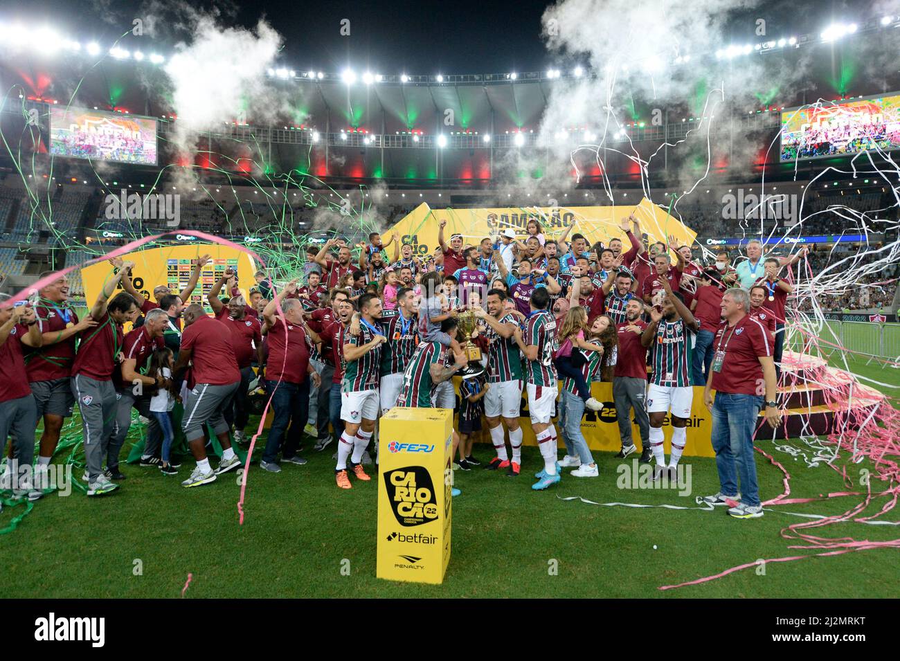 Players of Fluminense celebrate with the trophy after winning the Rio de Janeiro state championship final soccer match against Flamengo at Maracana st Stock Photo