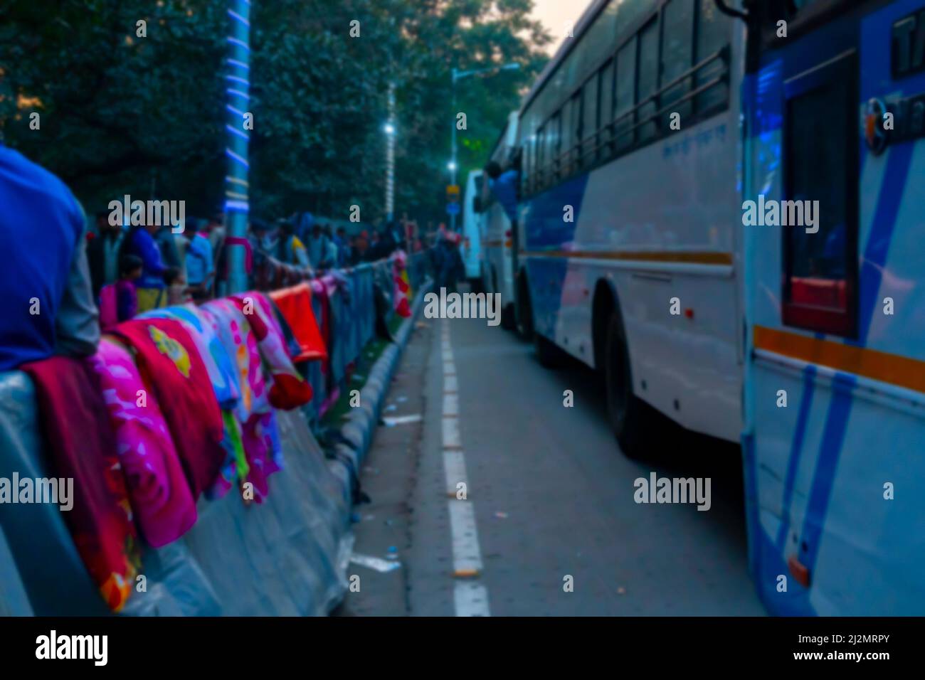 Blurred image of Kolkata, West Bengal, India. Colourful warm winter clothes are being sold at Gangasagar transit camp, Babughat, Kolkata Stock Photo