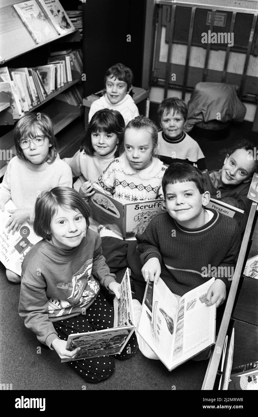 Bookworms Jennifer Shuttleworth, seven (left) and Andrew Parker, also seven, delve into the world of children's literature at a book fair at Upper Whitley Junior and Infants School. A Kirklees Bookerama bus visited the school as part of a week-long scheme to encourage pupils to read more.  2nd March 1990. Stock Photo