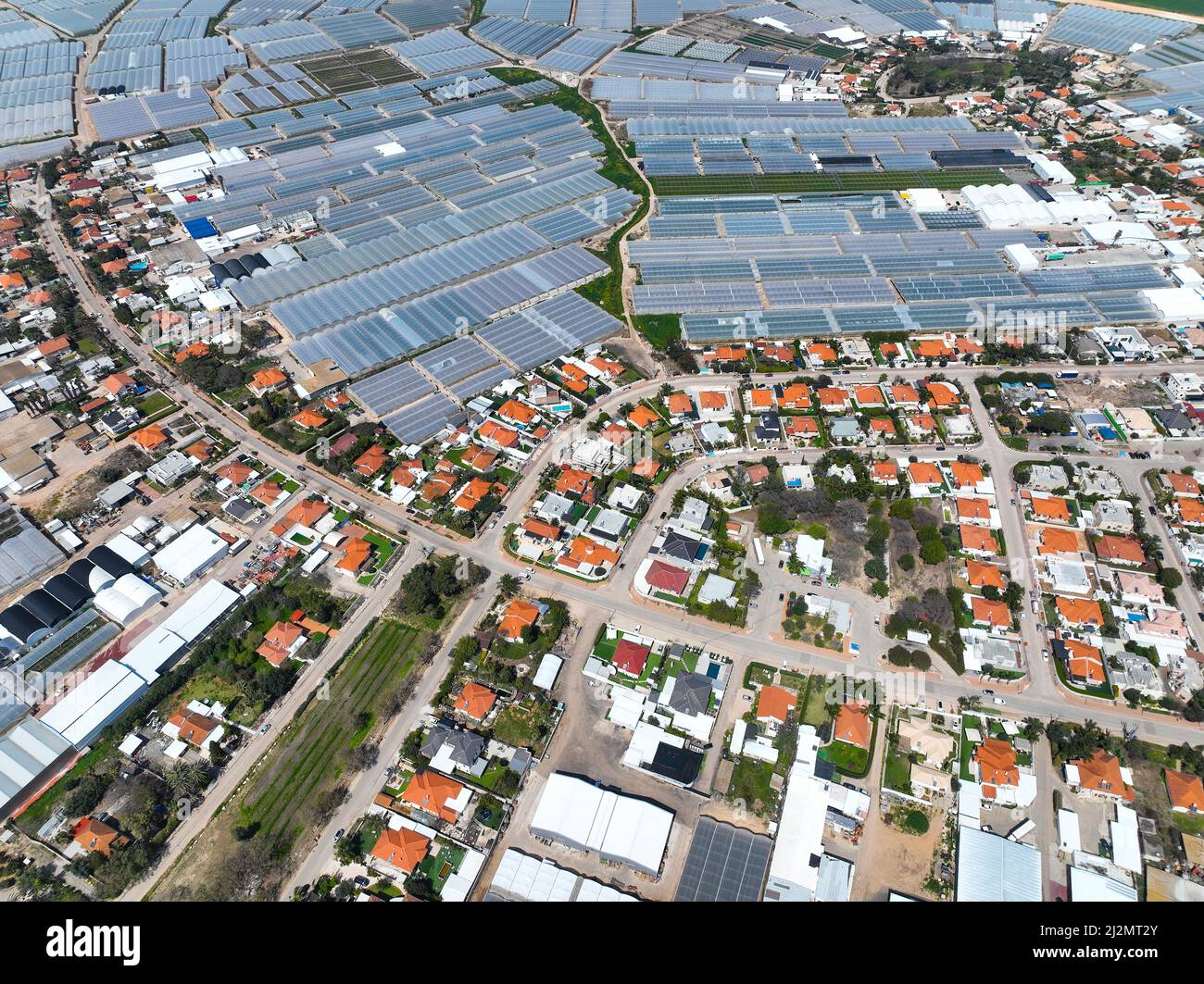 Greenhouse farming, vast land utilized for greenhouse agriculture, Aerial view. Stock Photo