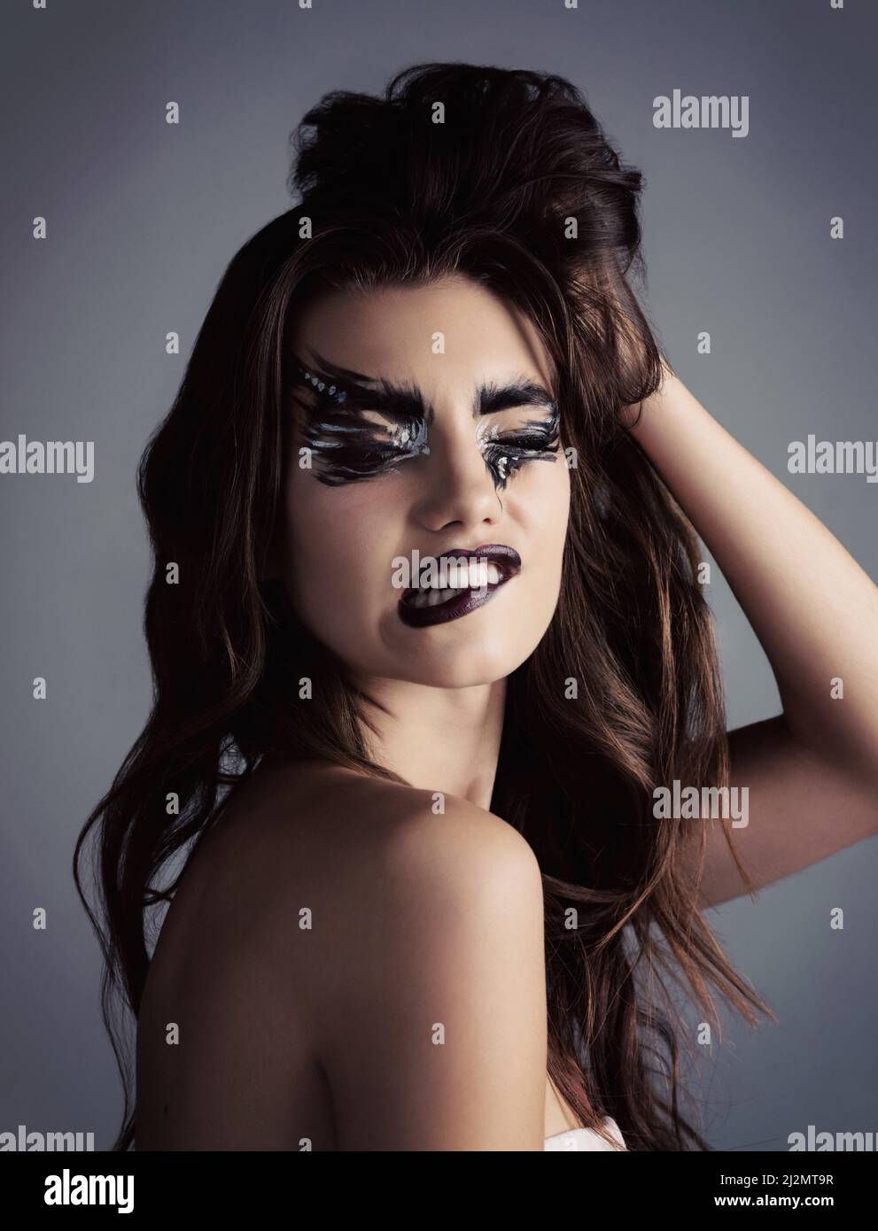 Makeup is art. Beauty is spirit. Studio shot of an attractive young woman wearing bold makeup. Stock Photo