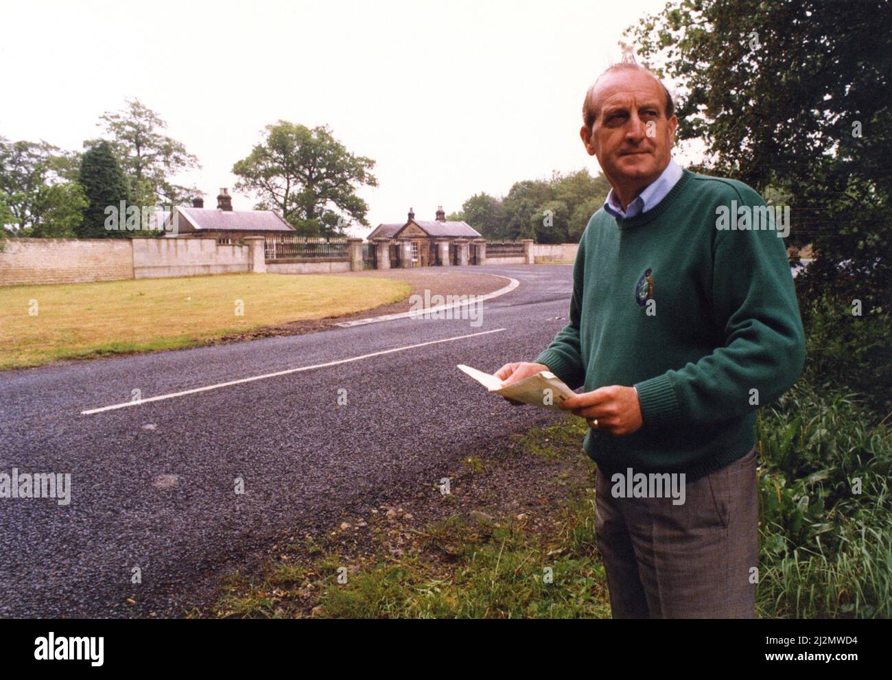 Sir John Hall, property developer (knighted 1991) and life president and former chairman of Newcastle United football club (1992 to 1997), pictured at Wynyard Hall Estate, County Durham, 10th June 1991. Our Picture Shows ... Sir John Hall standing at the gates to Wynyard Hall, he is currently fighting against plans for a waste tip near his home, where he wants to build houses. Stock Photo