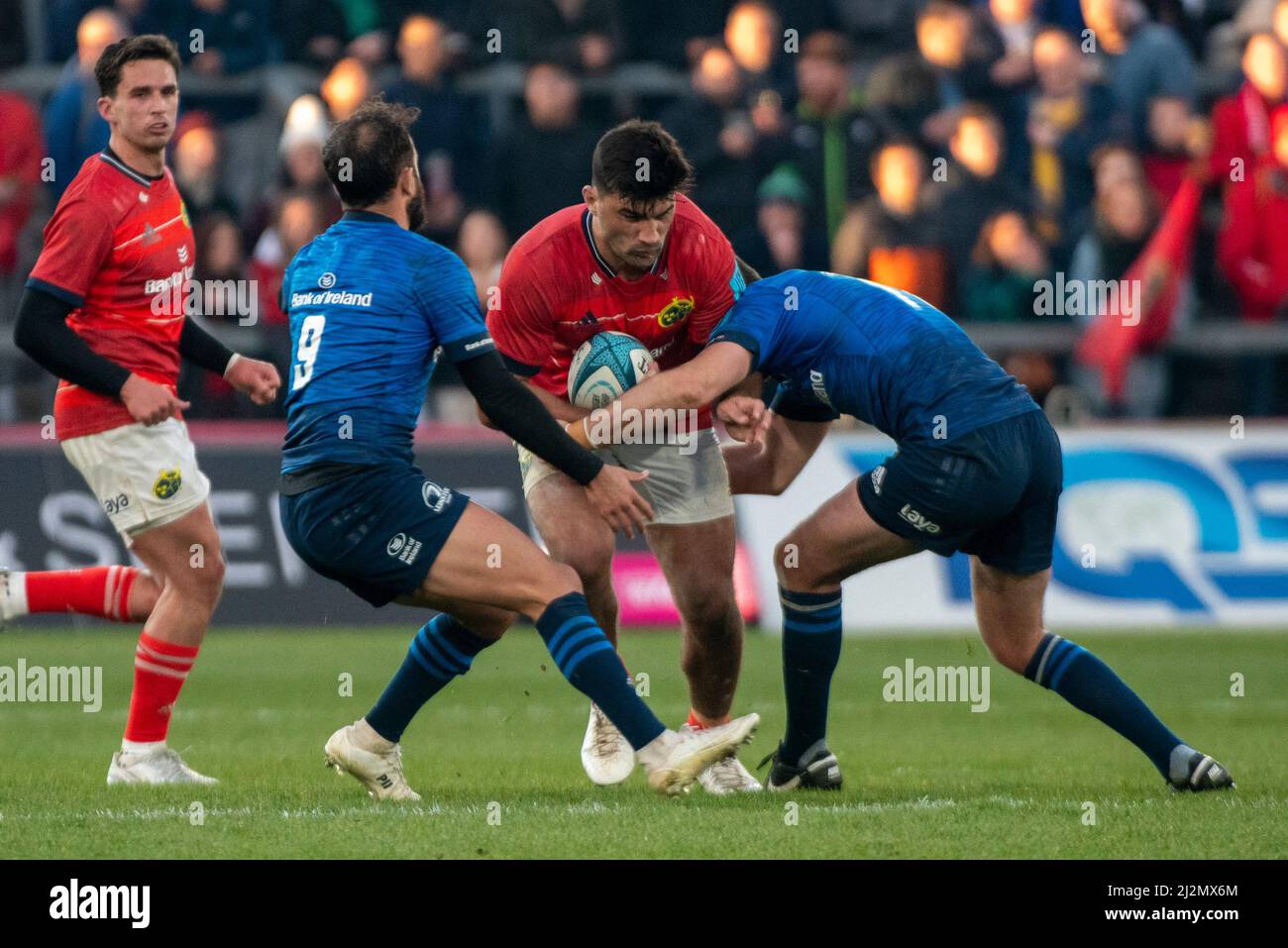 Damian De Allende of Munster tackled by Jamison Gibson-Park of Leinster during the United Rugby Championship Round 15 match between Munster Rugby and Leinster Rugby at Thomond Park in Limerick, Ireland on