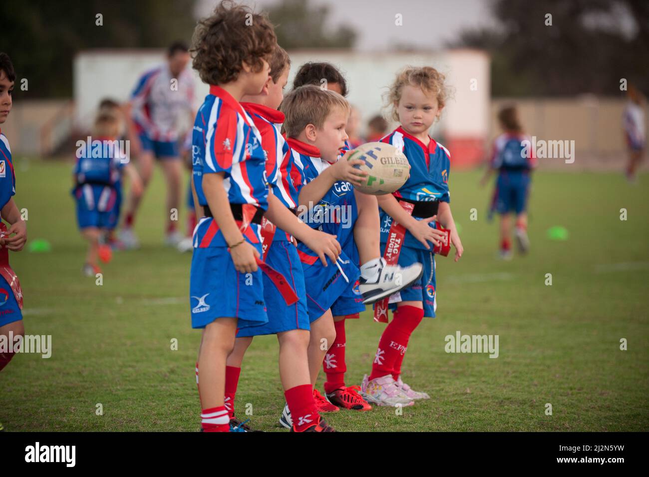 young kids playing rugby Stock Photo Alamy