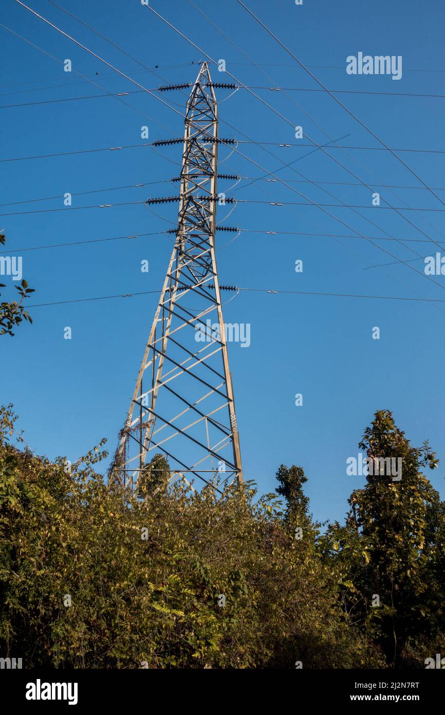 Electricity poles with overhead transformers in India. Stock Photo