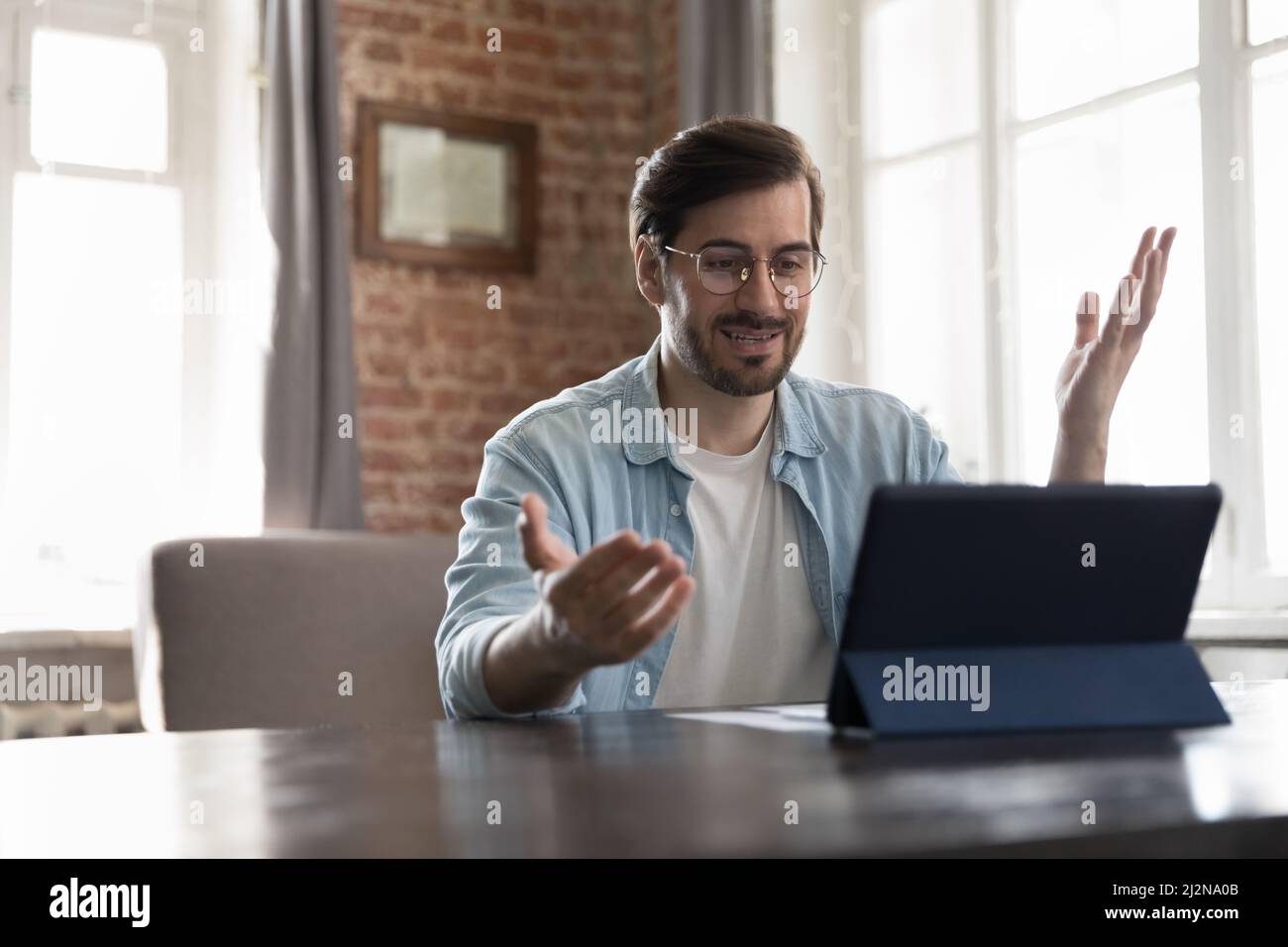 Engaged online teacher giving webinar, explaining lesson Stock Photo