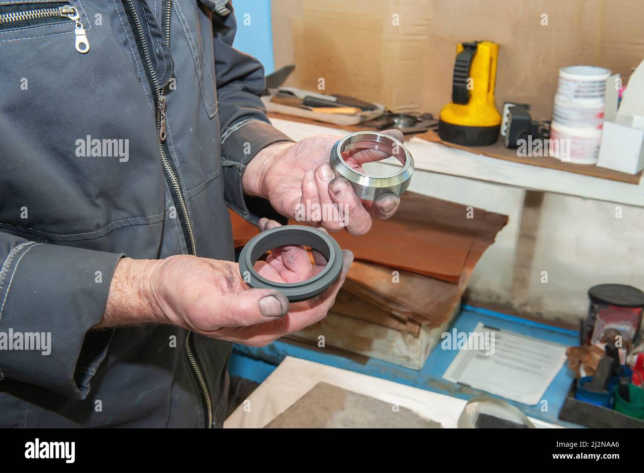 worker uses his hands to make the final polishing of stainless steel