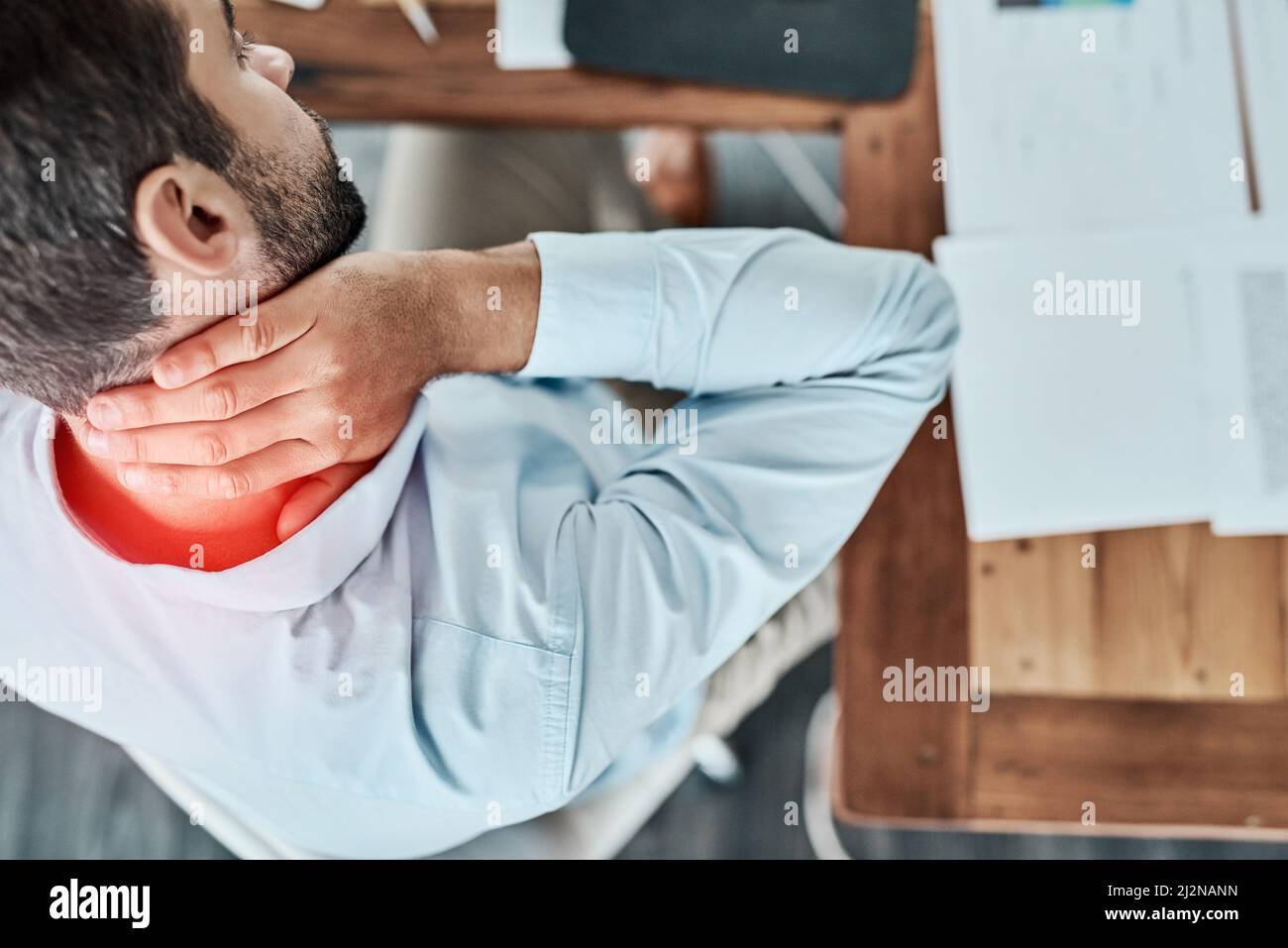 The day has turned into a real pain in the neck. High angle shot of a young businessman