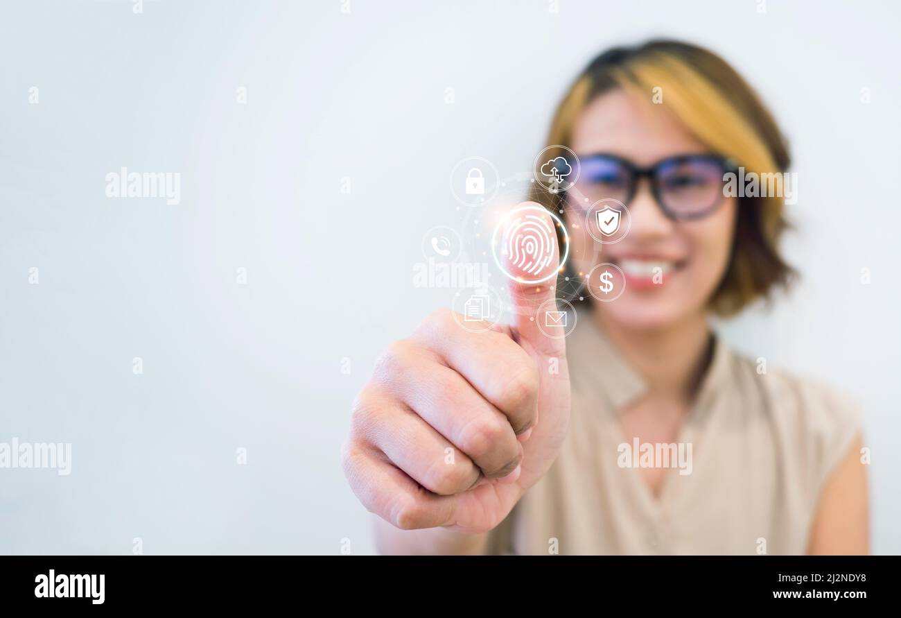 Fingerprint and business icons with woman thumb wearing glasses scanning for security access with biometrics identification on white background with c Stock Photo