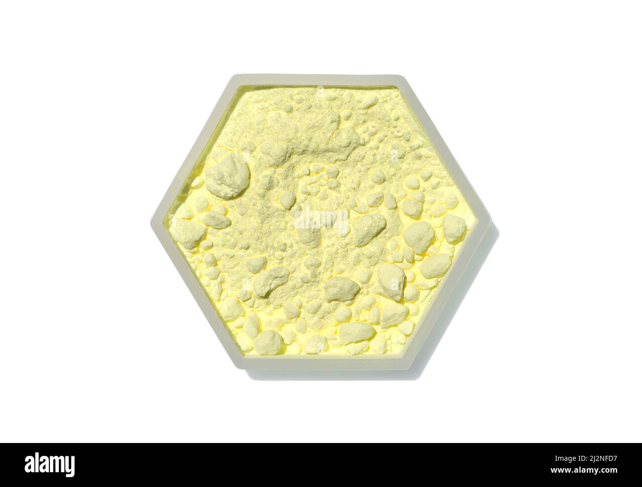 Sulfur Powder in hexagonal  molecular shaped container on white background. Top View Stock Photo