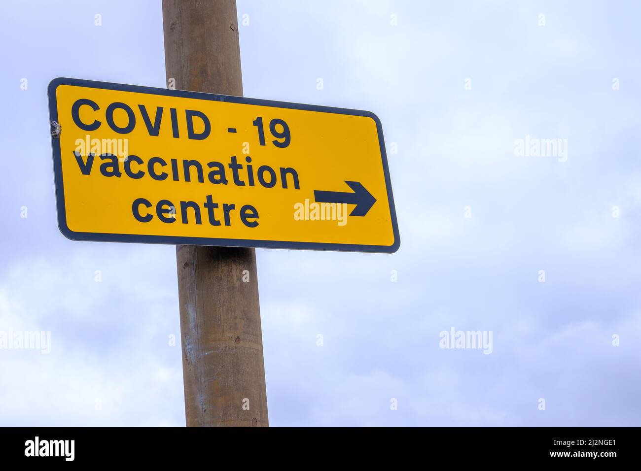 A Sign For A Covid Vaccination Centre With Copy Space Stock Photo