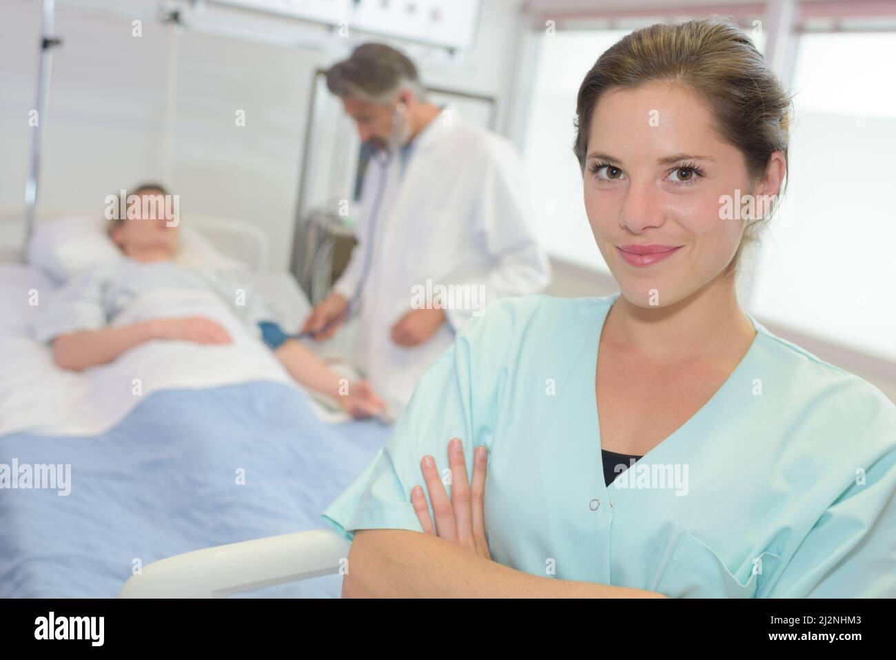 portrait of beautiful female nurse hospital bed in background Stock ...