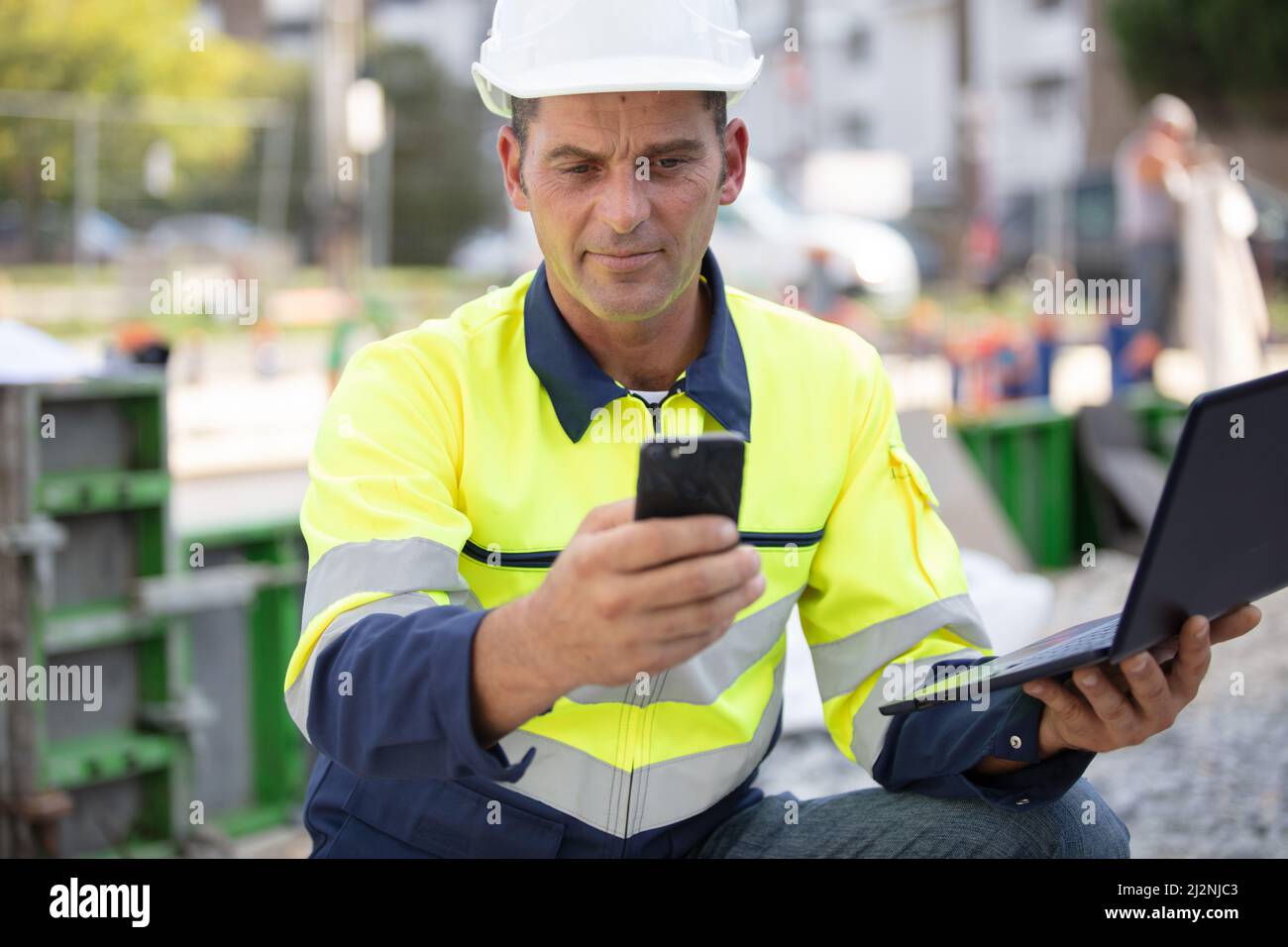 architect supervising a construction outdoords Stock Photo