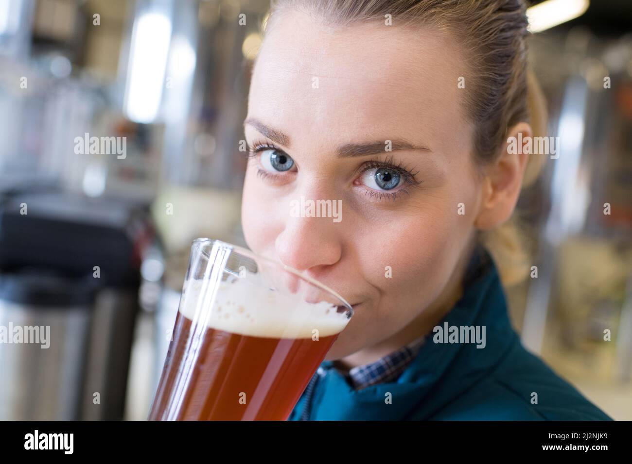 young-female-tasting-draft-beer-in-bar-stock-photo-alamy