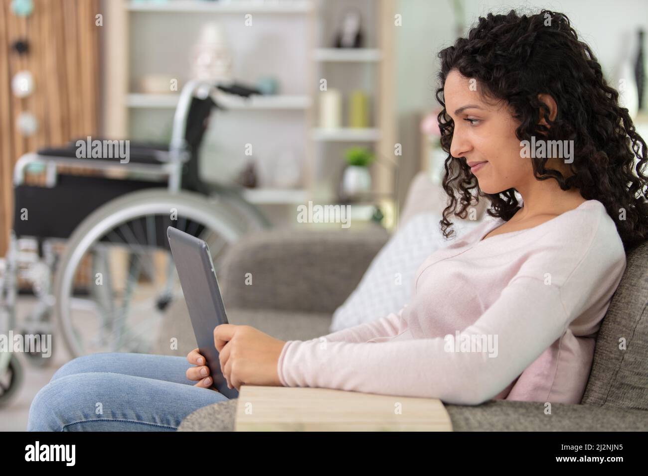 lazy disabled woman resting on a couch at home Stock Photo Alamy