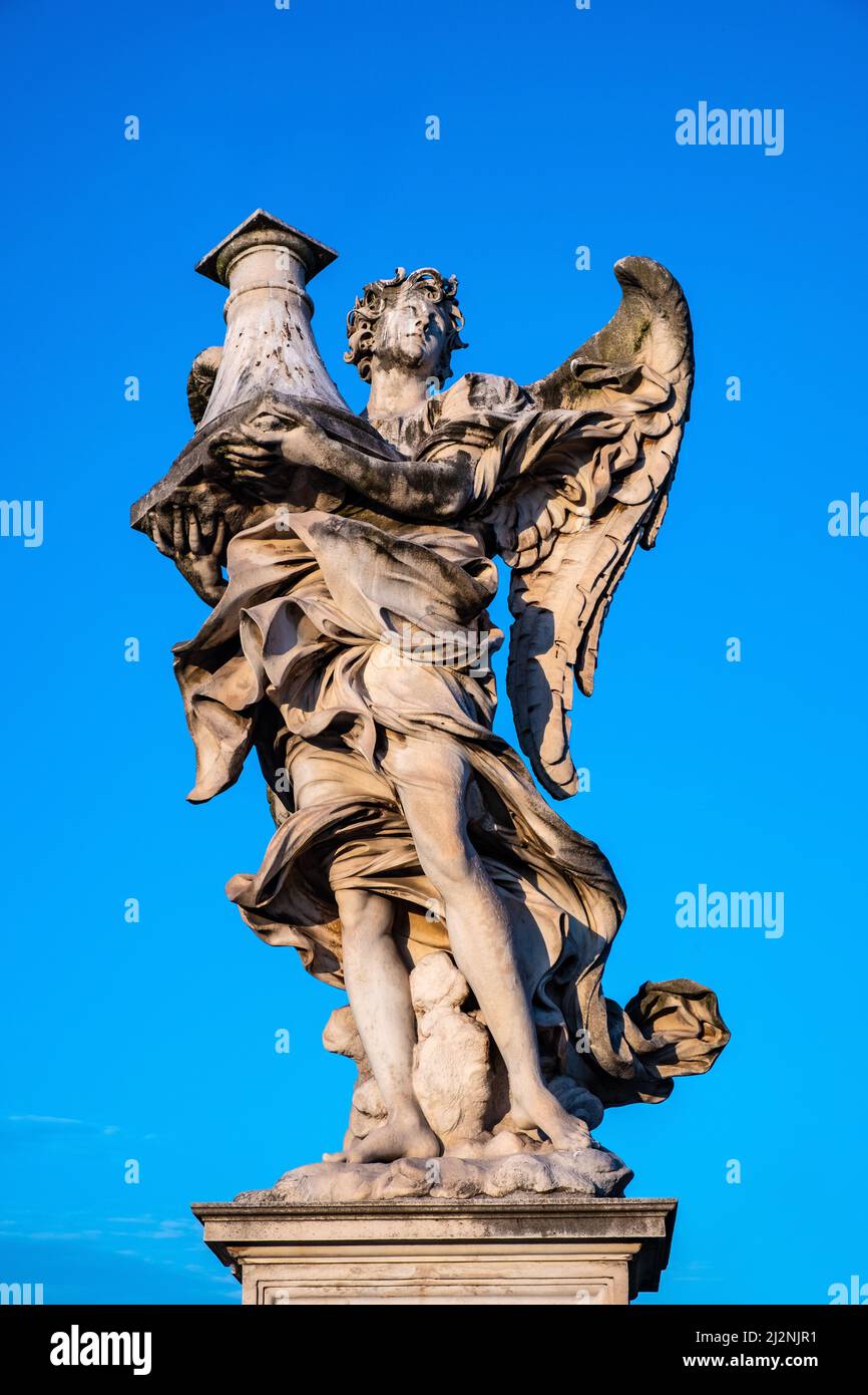 Rome, Italy - May 27, 2018: Angel with the Column statue by Antonio Raggi on Ponte Sant'Angelo Saint Angel Bridge over Tiber river in historic center Stock Photo