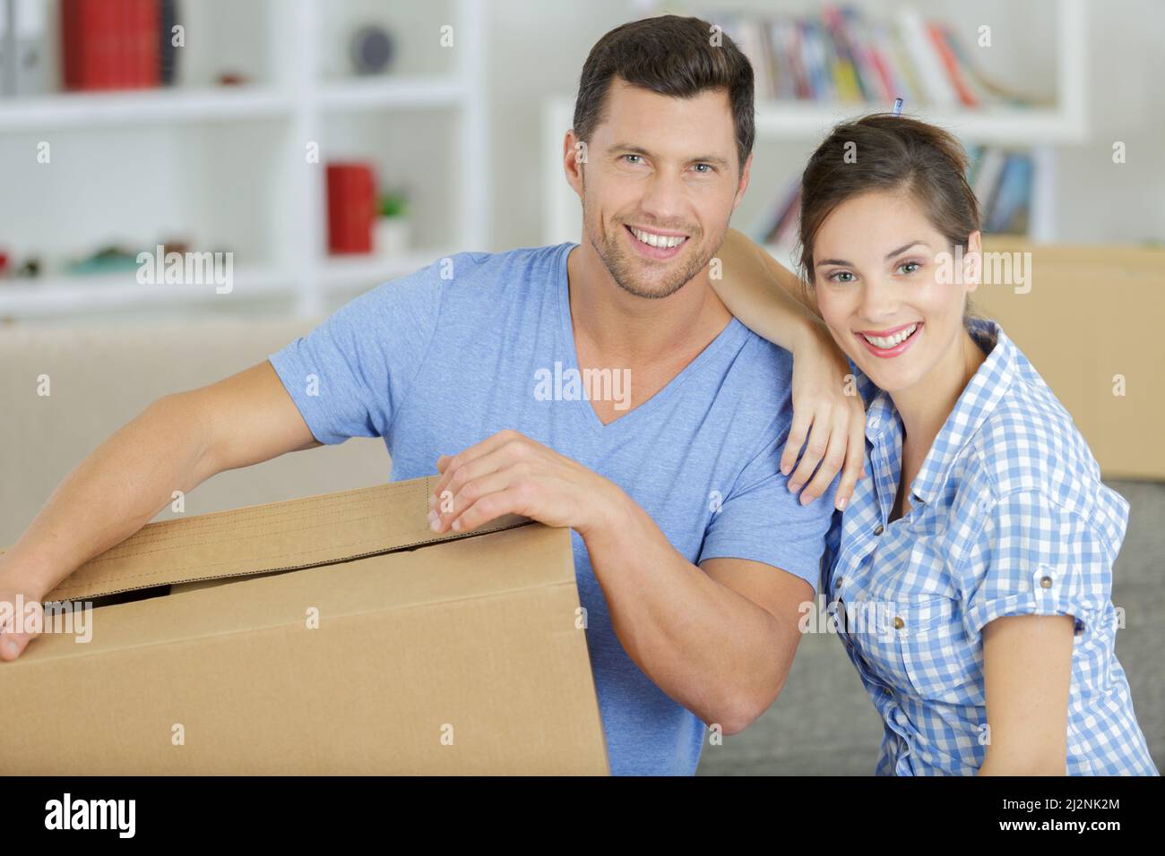 happy couple is moving to their new home Stock Photo - Alamy