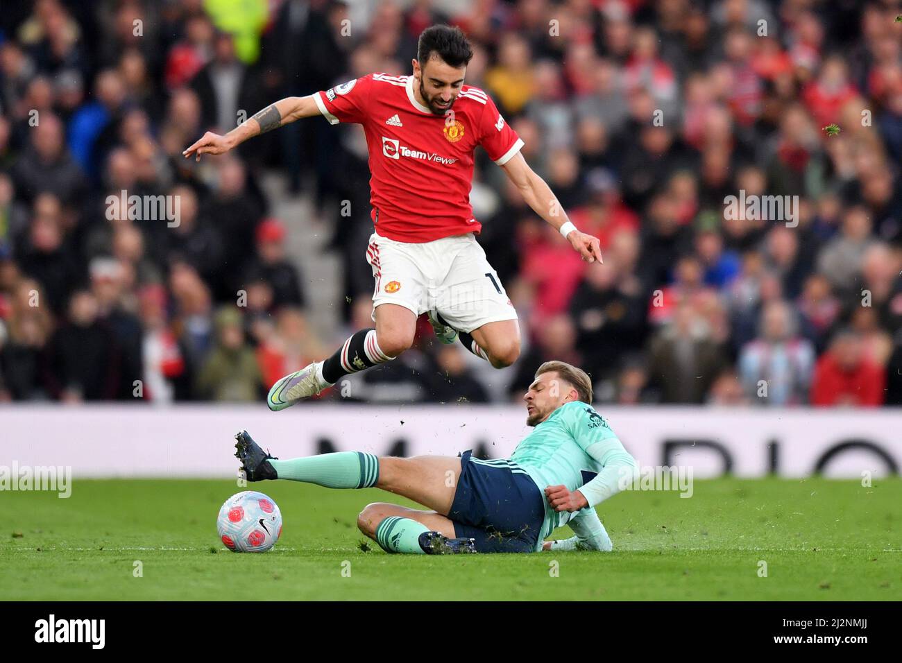 Manchester United's Bruno Fernandes is tackled by Leicester City's Kieran Dewsbury-Hall during the Premier League match at Old Trafford, Greater Manchester, UK. Picture date: Saturday April 2, 2022. Photo credit should read: Anthony Devlin Stock Photo