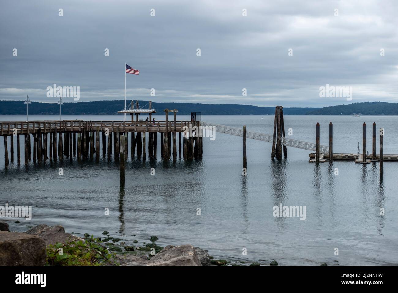Tacoma, WA USA - circa August 2021: View of a beach by Commencement Bay on an overcast day. Stock Photo