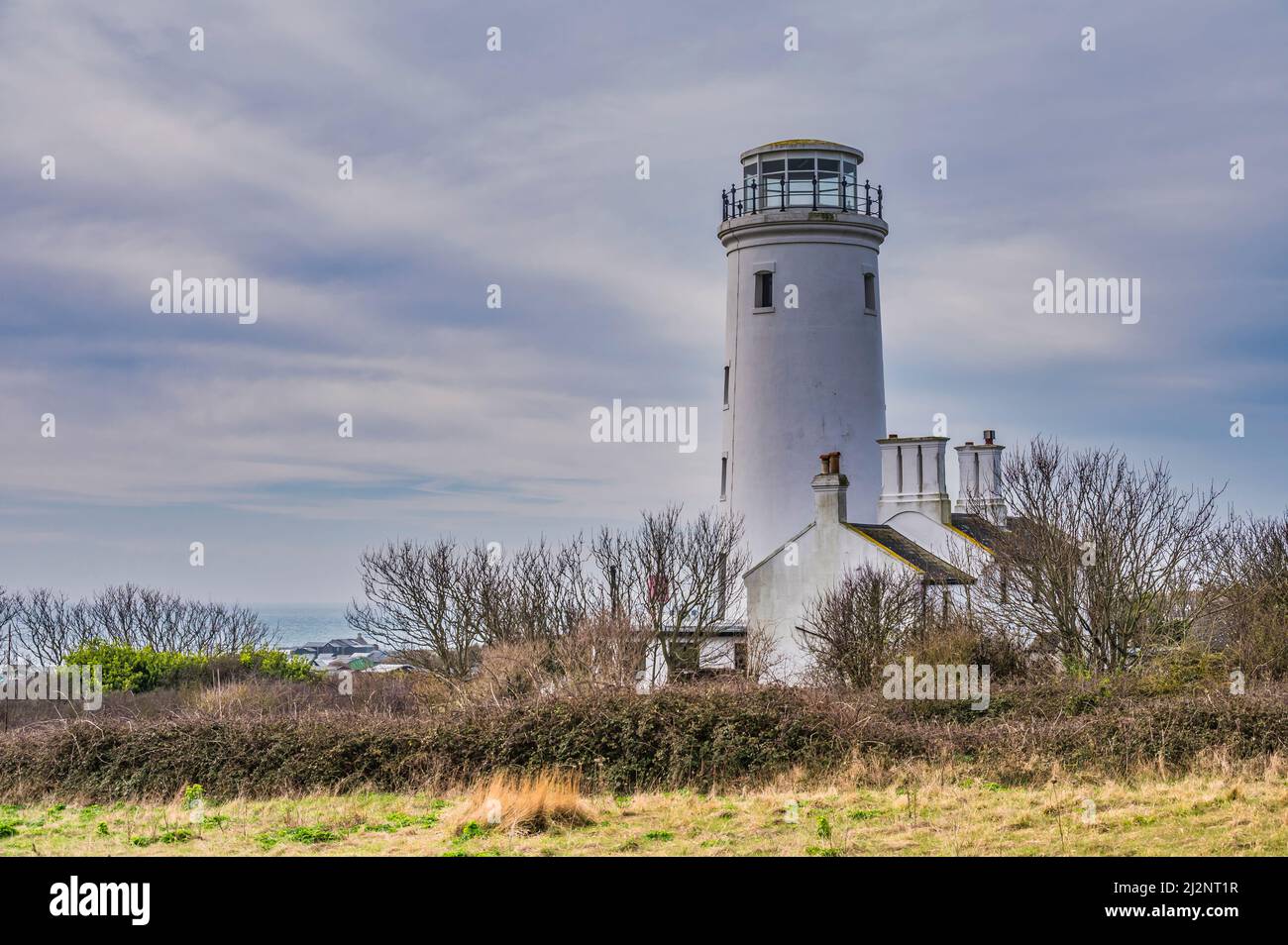 Portland Bill lower lighthouse is a disused 25metres high lighthouse located on the Isle of Portland near the coastal resort town of Weymouth Stock Photo