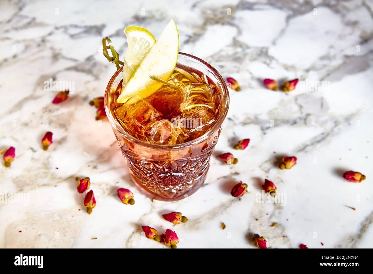 Cocktail with cognac in a glass of old fashion on the bar. Stock Photo