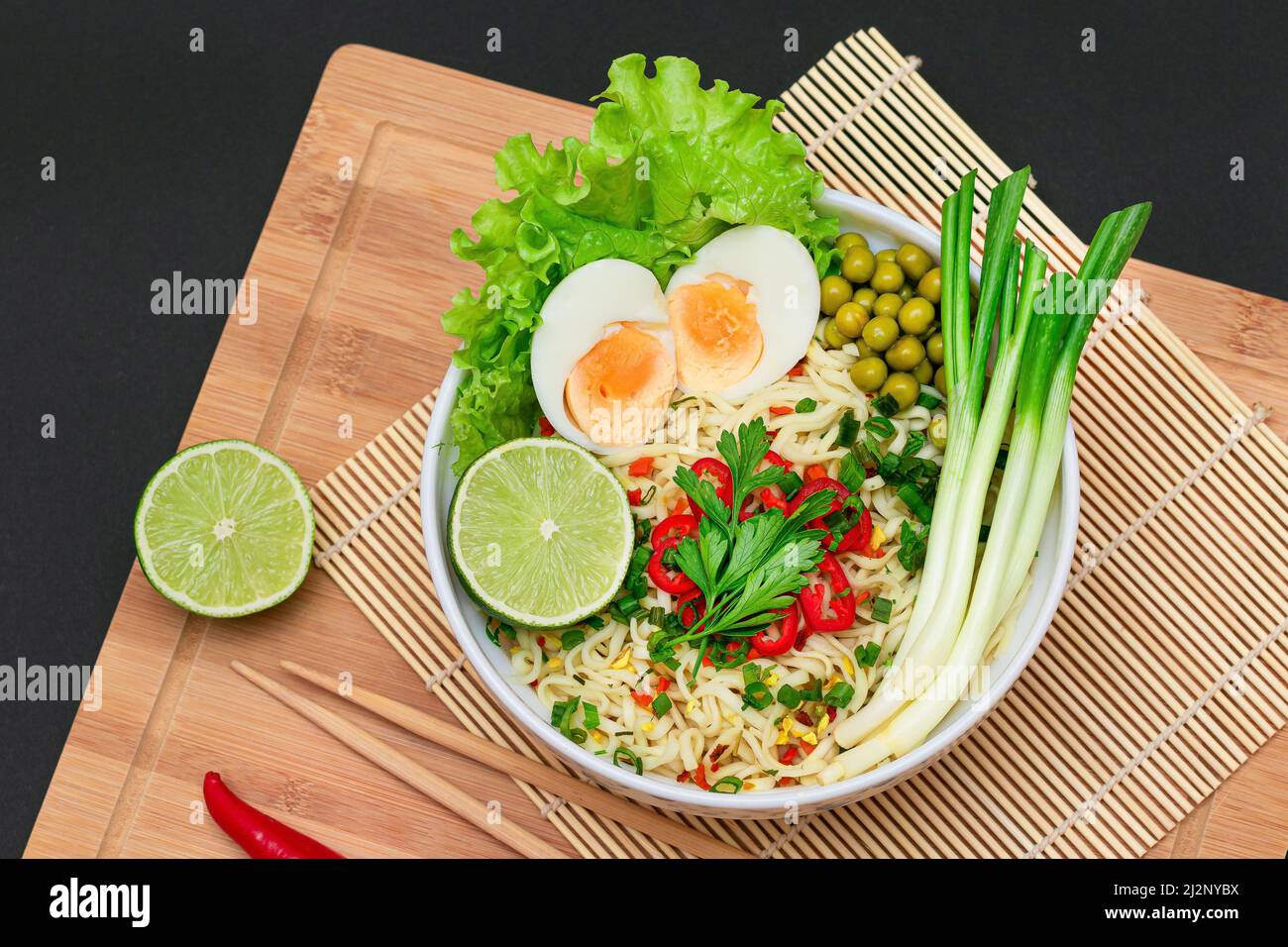 Beautiful Noodle Dish with Green Pea, Eggs, Red Hot Pepper, Greens and