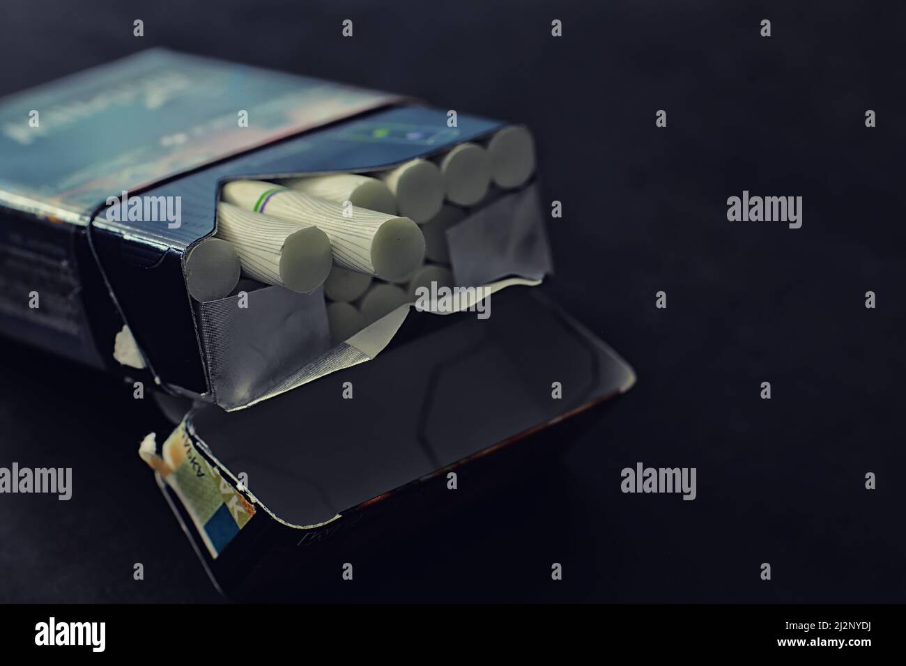 Tobacco smoking. Cigarettes in pack. Harmful deadly habit of smoking