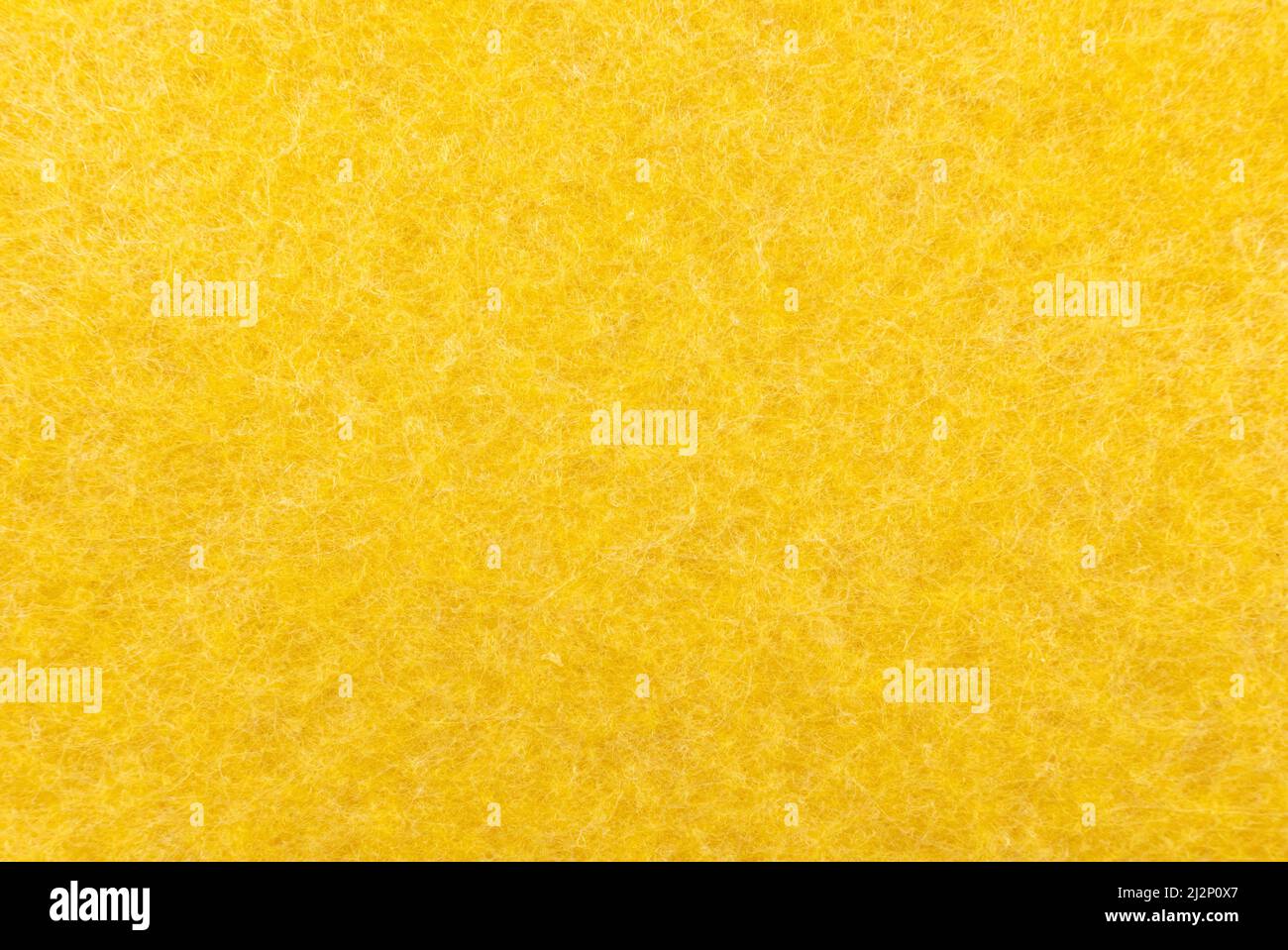 Background of moisture-absorbing yellow napkins. Porous water