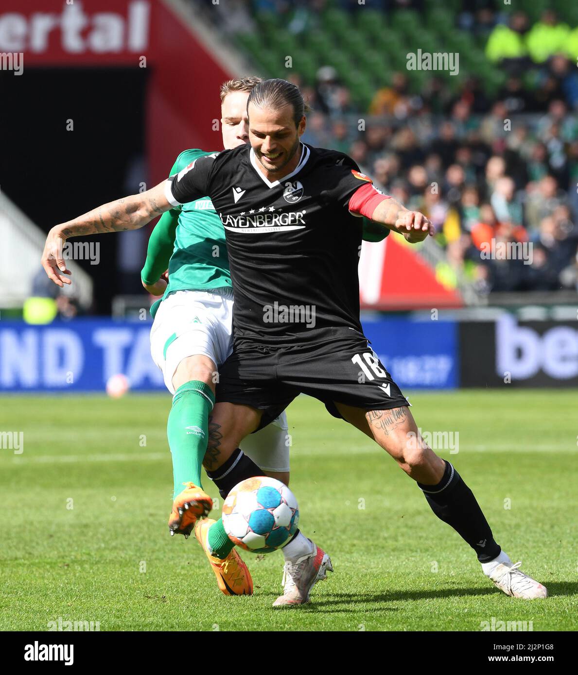 Bremen, Germany. 03rd Apr, 2022. Soccer: 2nd Bundesliga, Werder Bremen - SV Sandhausen, Matchday 28, wohninvest Weserstadion. Werder's Niklas Schmidt (l) fights for the ball against Sandhausen's Dennis Diekmeier. Credit: Carmen Jaspersen/dpa - IMPORTANT NOTE: In accordance with the requirements of the DFL Deutsche Fußball Liga and the DFB Deutscher Fußball-Bund, it is prohibited to use or have used photographs taken in the stadium and/or of the match in the form of sequence pictures and/or video-like photo series./dpa/Alamy Live News Stock Photo
