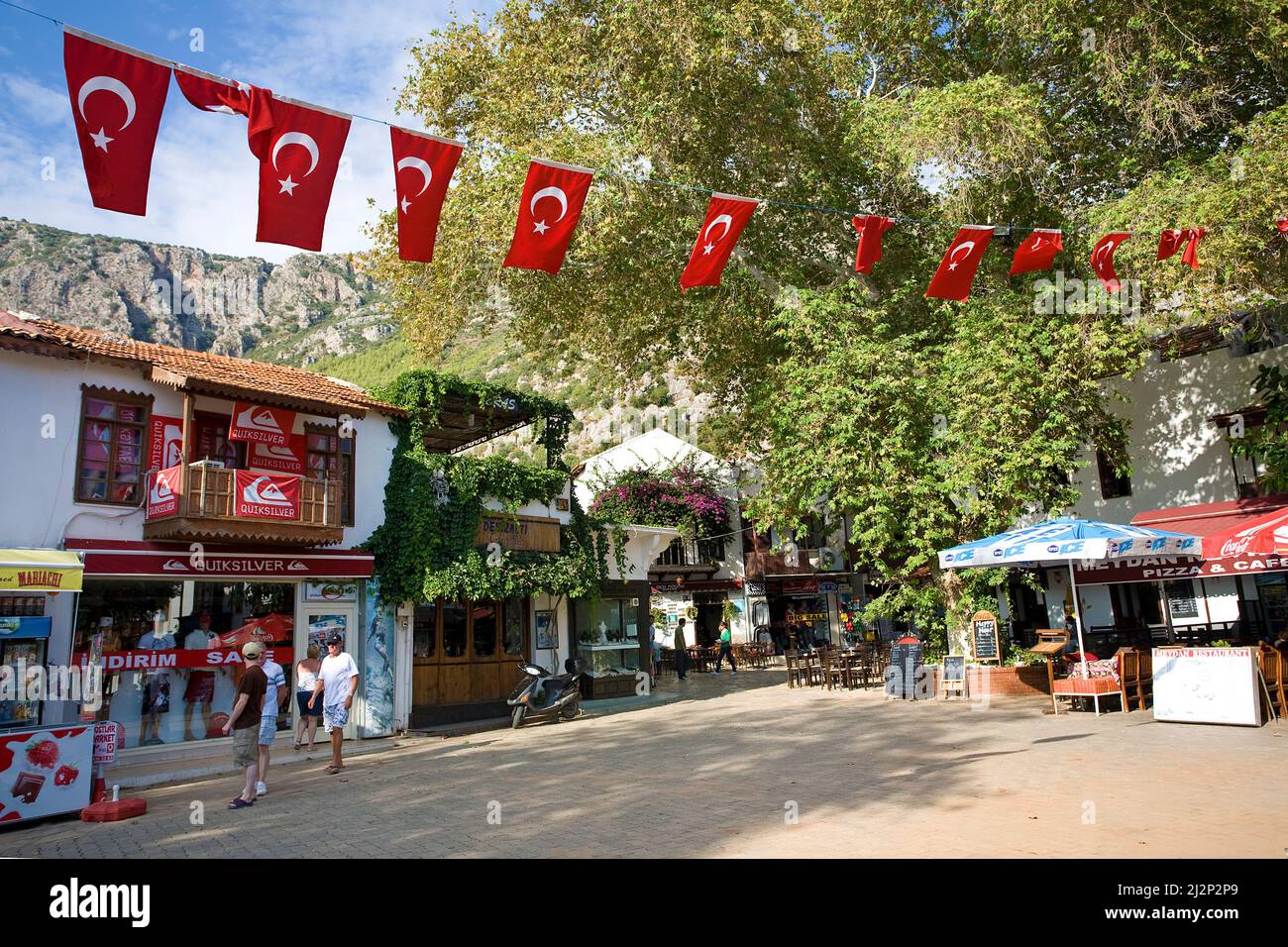 With national flags decorated square at old town of Kas, Lycia, Turkey, Mediteranean sea Stock Photo