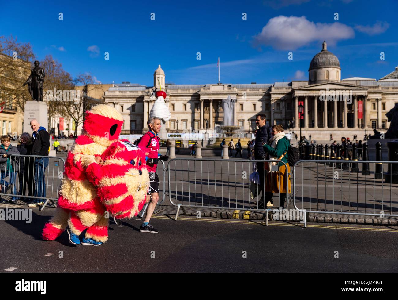 A runner dressed up as Bagpuss going past the National Gallery during the 2022 London Landmarks Half Marathon. Picture date: Sunday April 3, 2022. Stock Photo