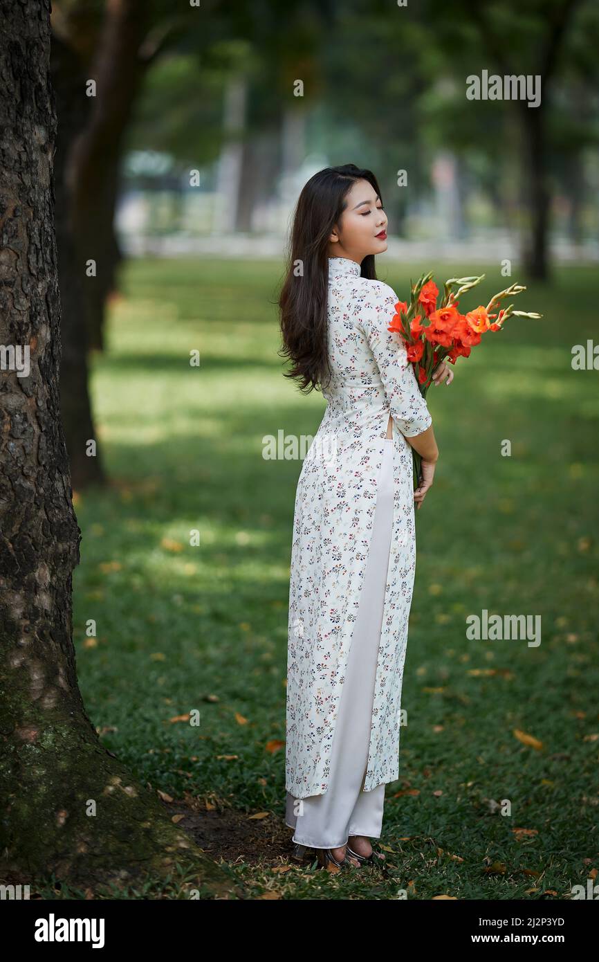 Ho Chi Minh city, Viet Nam: Portrait of a Vietnamese girl wearing a traditional Ao Dai Stock Photo