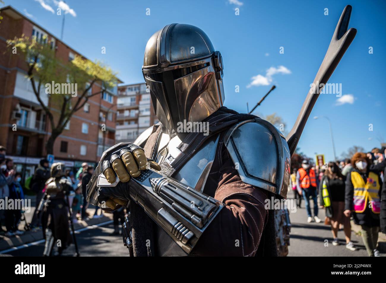 Madrid, Spain. 03rd Apr, 2022. A man dressed as the Mandalorian is seen marching during a Star Wars Parade in the Aluche neighborhood of Madrid. Nearly 300 people have paraded through the streets dressed with costumes as characters from the Star Wars saga. Credit: Marcos del Mazo/Alamy Live News Stock Photo