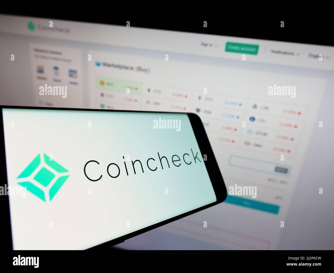 Smartphone with logo of Japanese cryptocurrency company Coincheck Inc. on  screen in front of business website. Focus on center of phone display Stock  Photo - Alamy