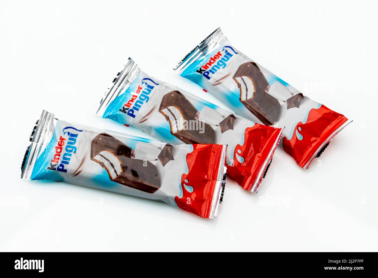 Alba, Italy - March 28, 2022: kinder Pingui Ferrero sponge cake snack filled with milk cream covered with chocolate, produced by Ferrero important con Stock Photo