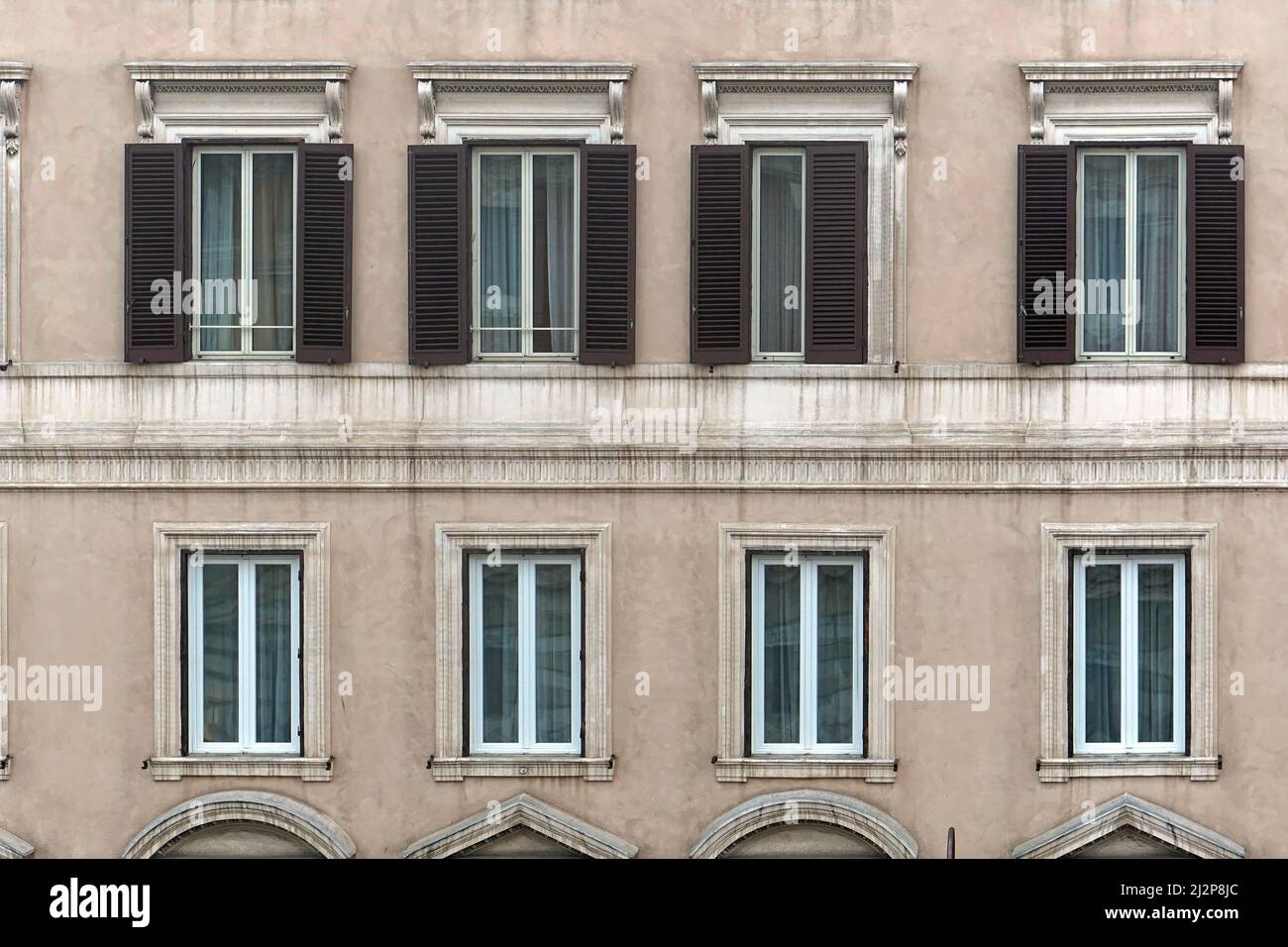 Window Styles On Rome Windows at classic style building in Rome Italy Stock Photo - Alamy