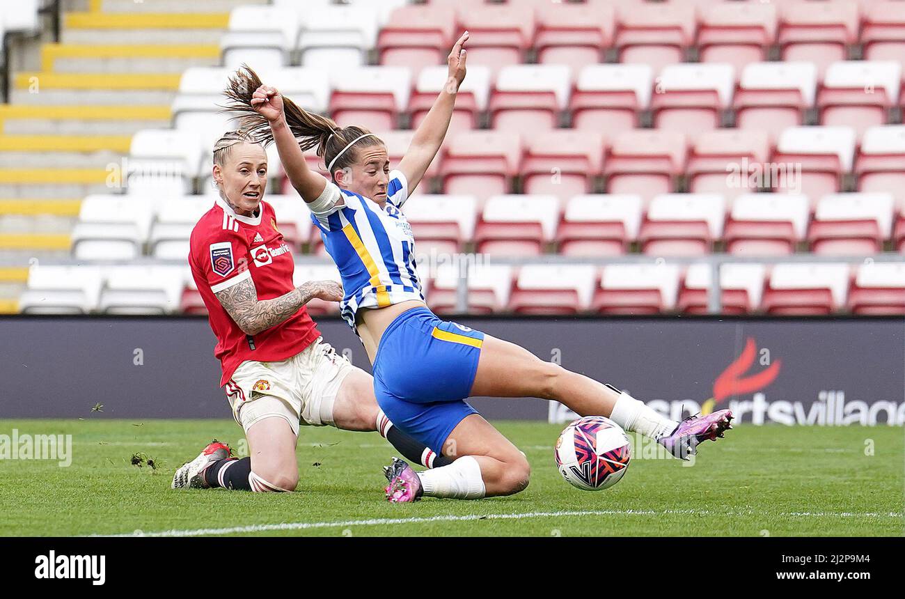 Manchester United's Leah Galton (left) scores their side's first goal of the game past Brighton and Hove Albion's Maya Le Tissier, during the Barclays FA Women's Super League match at the Leigh Sports Village, Manchester. Picture date: Sunday April 3, 2022. Stock Photo