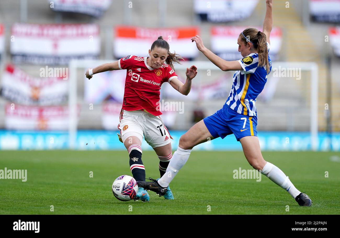Manchester United's Ona Batlle battles for the ball with Brighton and Hove Albion's Aileen Whelan, during the Barclays FA Women's Super League match at the Leigh Sports Village, Manchester. Picture date: Sunday April 3, 2022. Stock Photo