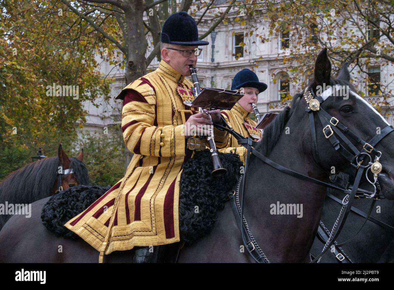 Close up of 2 members of The Band of The Household Cavalry playing clarinets on horseback at the Lord Mayor’s Show 2021 Victoria Embankment, London. Stock Photo
