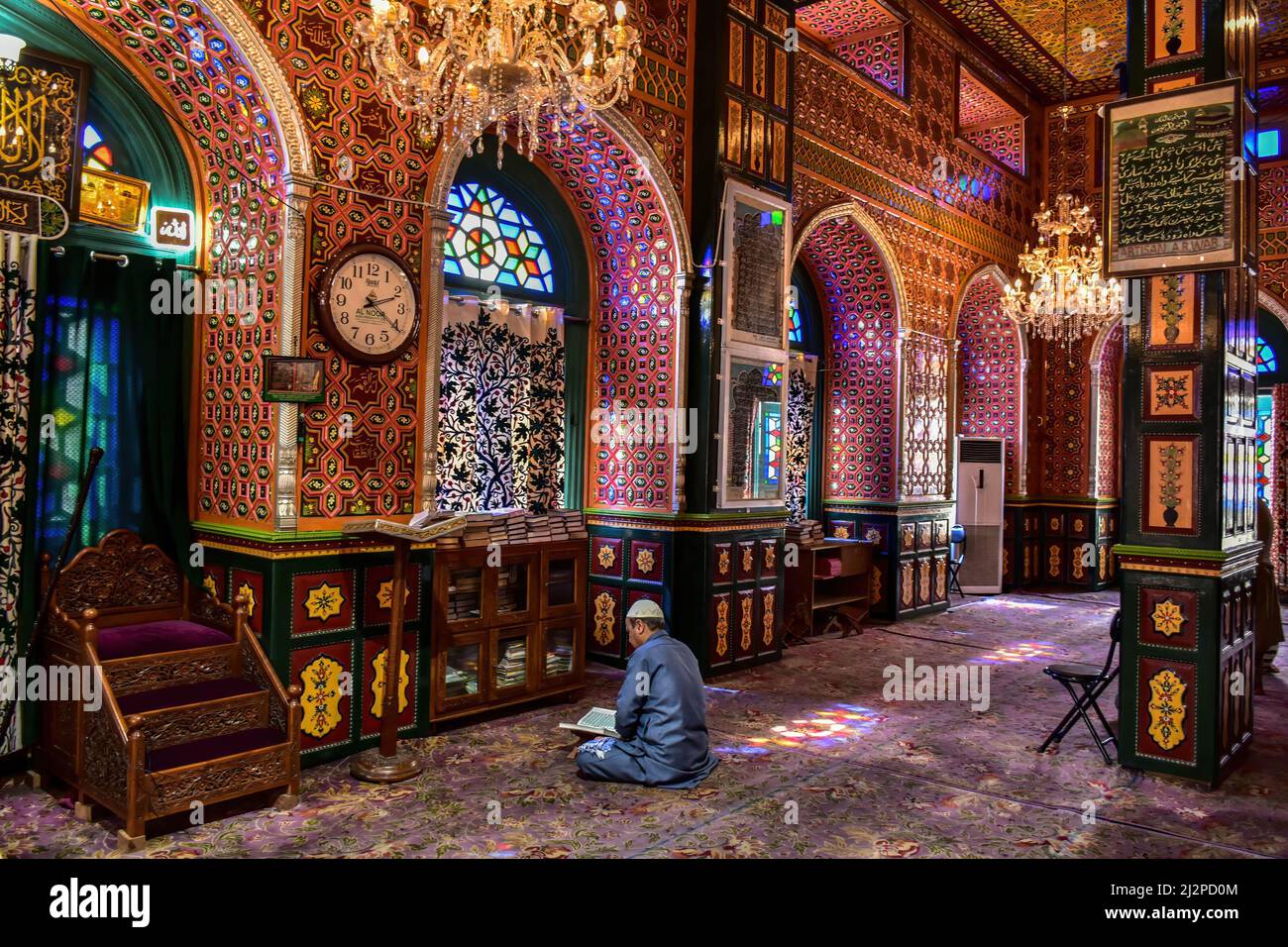 Srinagar, India. 03rd Apr, 2022. A Kashmiri man recites the Holy Quran ...