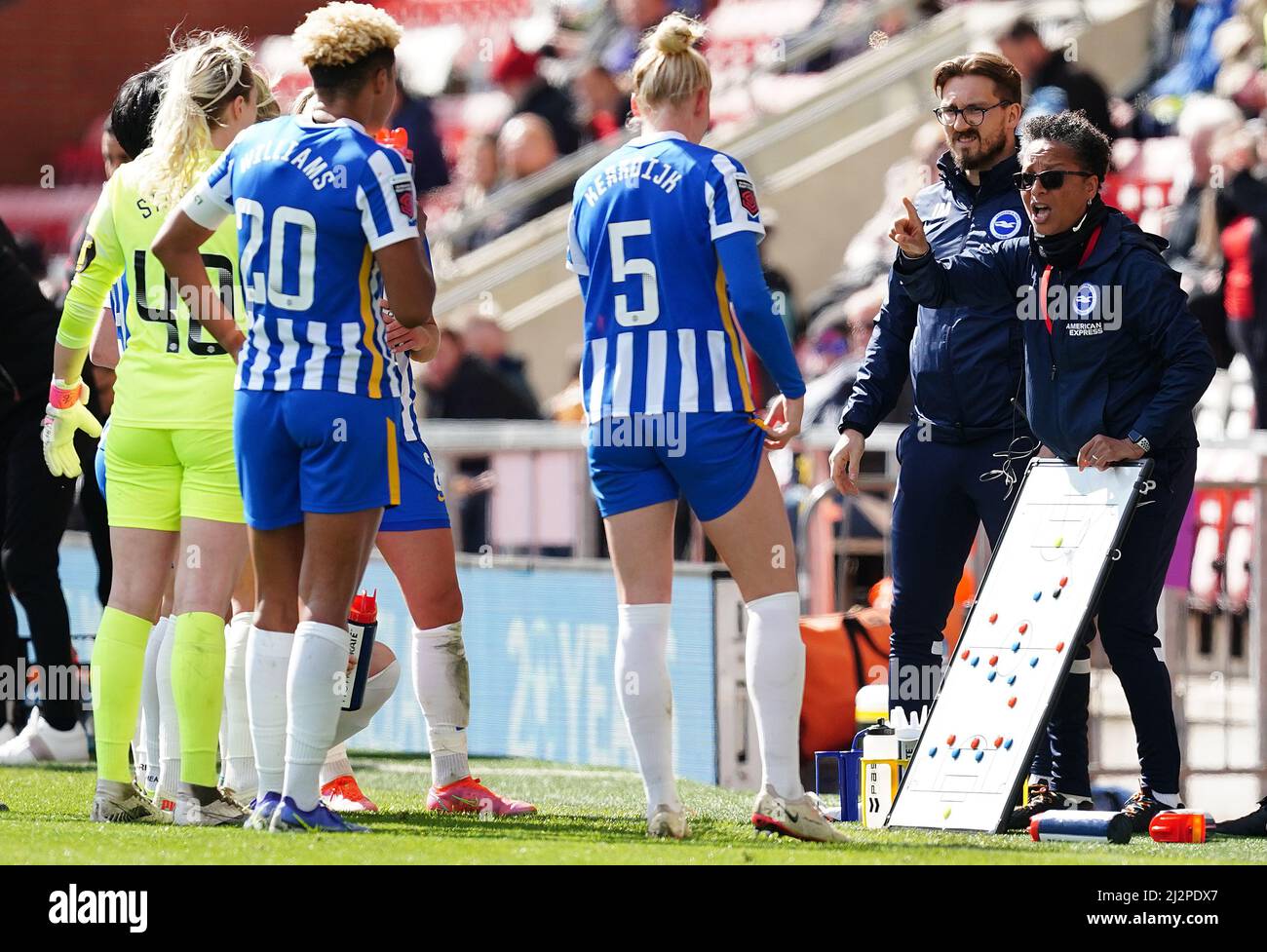 Brighton and Hove Albion manager Hope Powell uses a tactics board as she issues instructions to her team against Manchester United, during the Barclays FA Women's Super League match at the Leigh Sports Village, Manchester. Picture date: Sunday April 3, 2022. Stock Photo