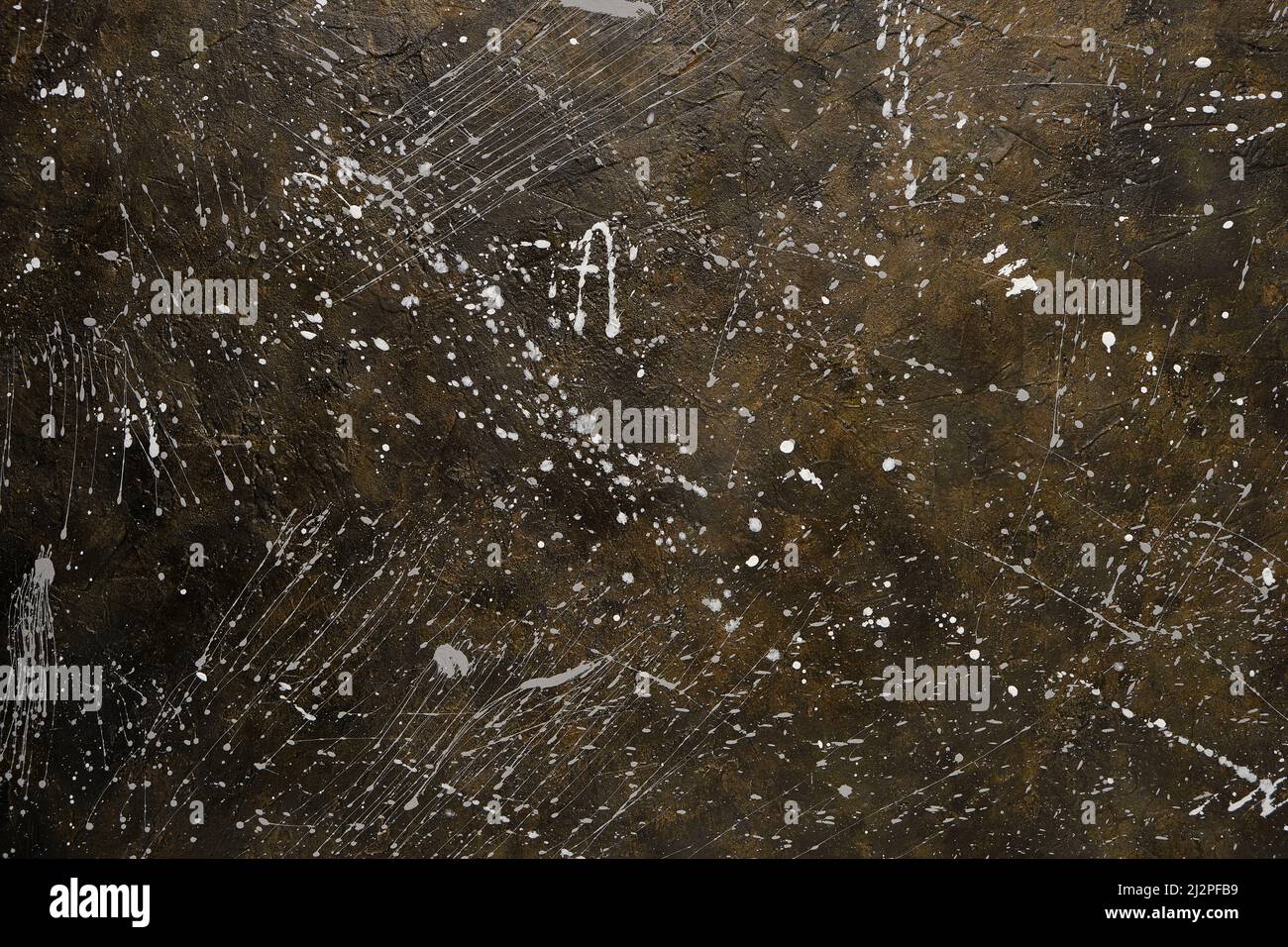 Abstract concrete background splattered with paint drops Stock Photo